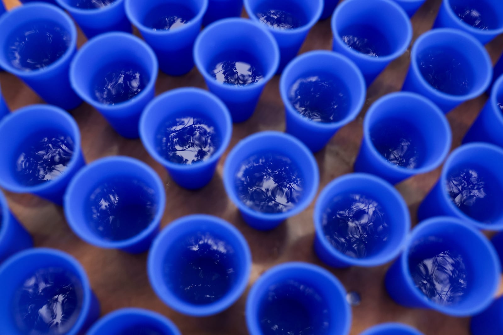 Water is available to runners in Hiccup, reusable silicone cups, during the PNC Women Run the Cities race on Saturday, May 17, 2025, in Minneapolis. (AP Photo/Ellen Schmidt)
