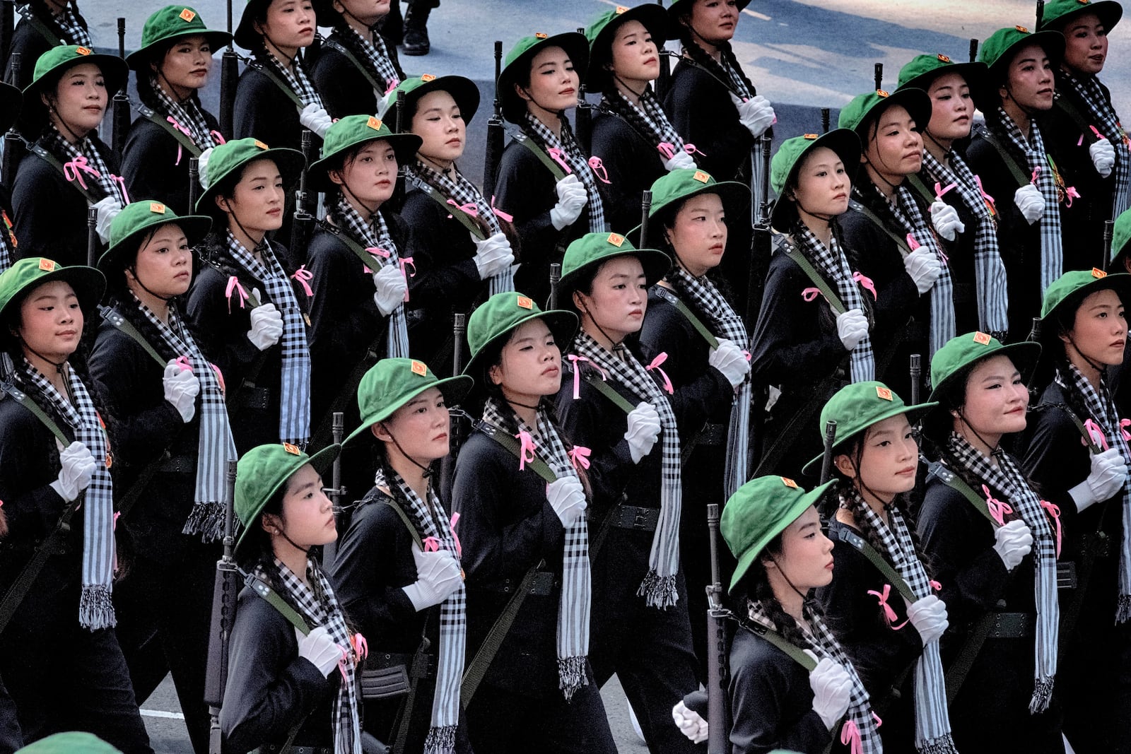Women soldiers in North Vietnamese Army costumes march during a parade celebrating the 50th anniversary of the end of the war on Wednesday, April 30, 2025, in Ho Chi Minh City, Vietnam. (AP Photo/Richard Vogel)