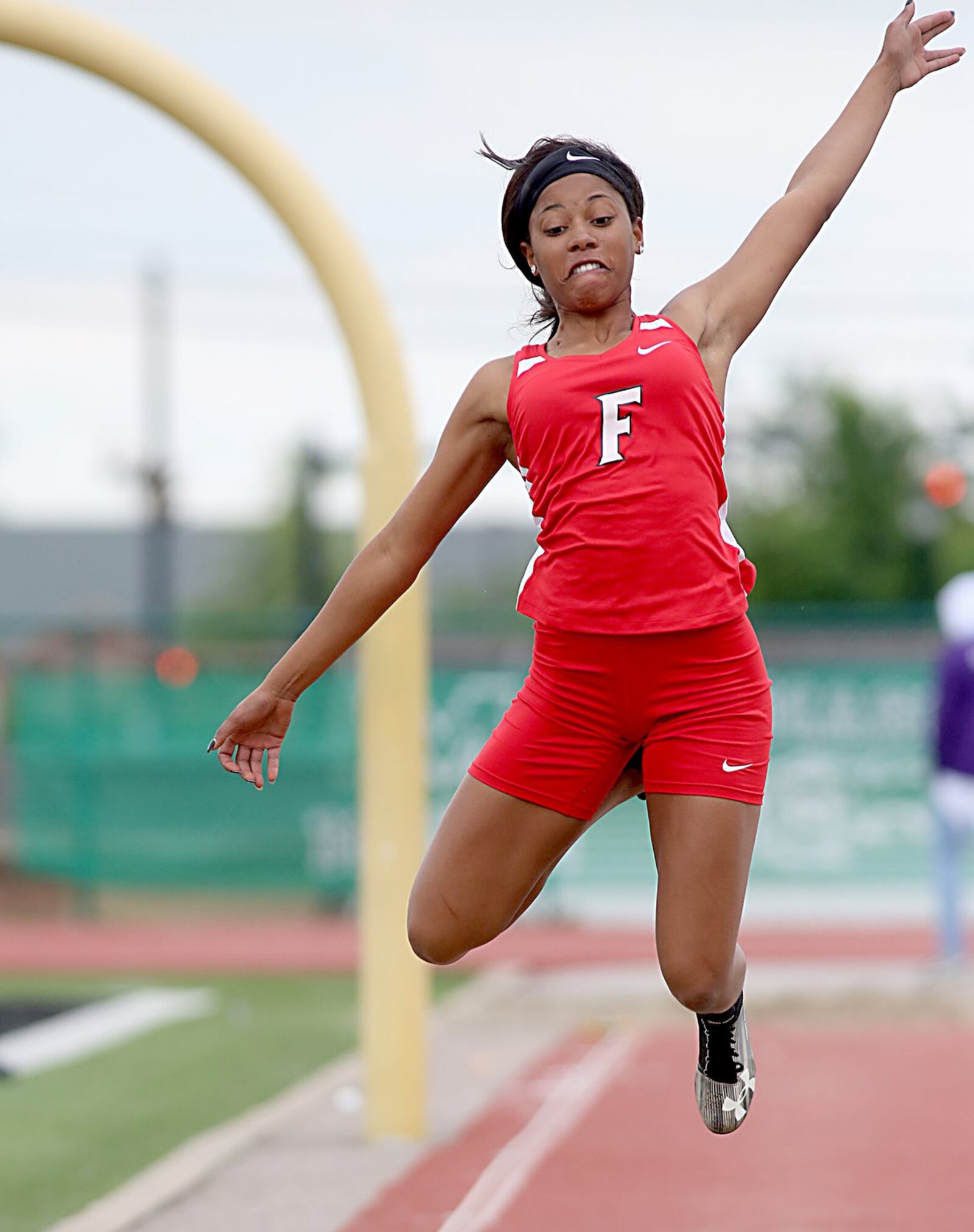 Fairfield’s Monica Johnson flies through the air in the long jump Friday during the Greater Miami Conference track & field meet on Dwire Field at Atrium Stadium in Mason. CONTRIBUTED PHOTO BY E.L. HUBBARD