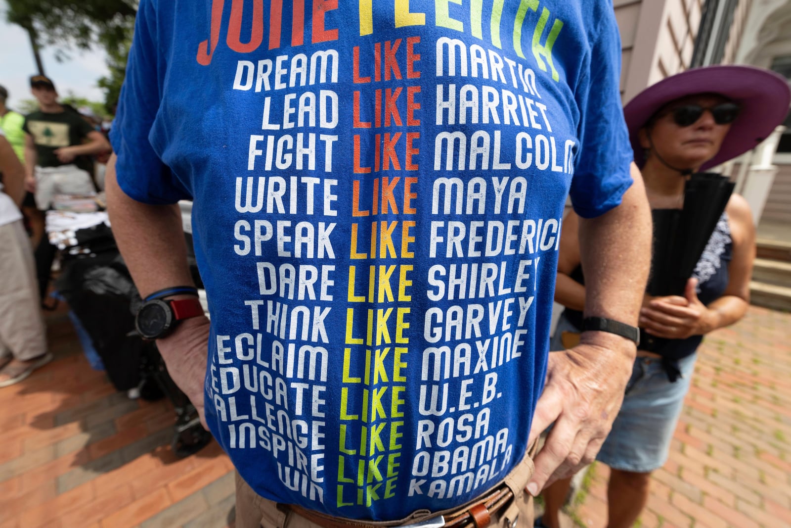Paul Wendell wears a Juneteenth themed t-shirt during a Juneteenth celebration at the African Burying Ground Memorial Park Thursday, June 19, 2025, in Portsmouth, N.H. (AP Photo/Michael Dwyer)