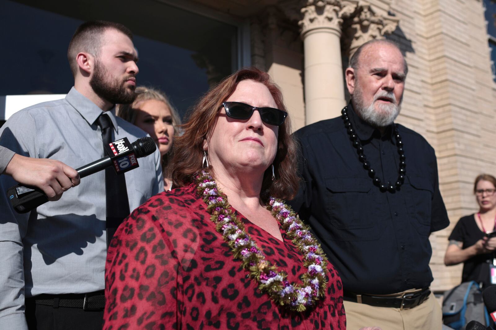 FILE - Kay Woodcock, center, and Larry Woodcock, right, address the media outside court at a hearing for Lori Vallow Daybell on Friday, March 6, 2020, in Rexburg, Idaho. (John Roark/The Idaho Post-Register via AP, Pool)