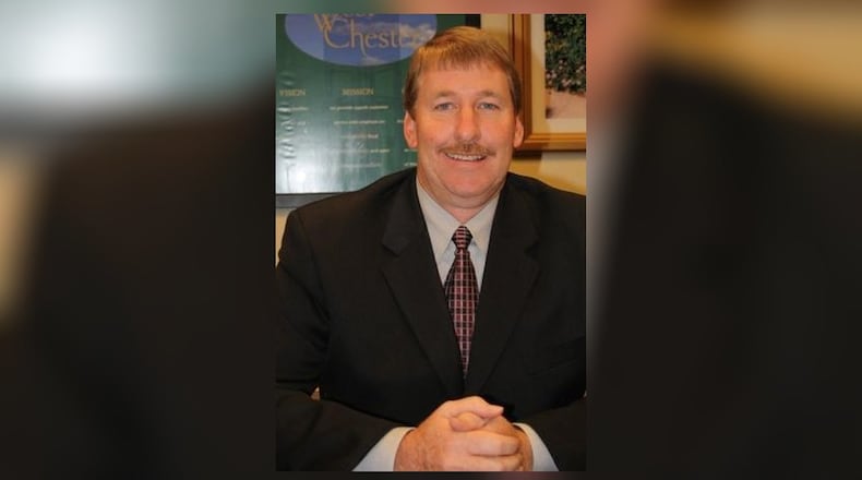 Tim Franck, Community Services Director, West Chester Township offers the community a preview of Keehner Park s newest playground. GINNY MCCABE