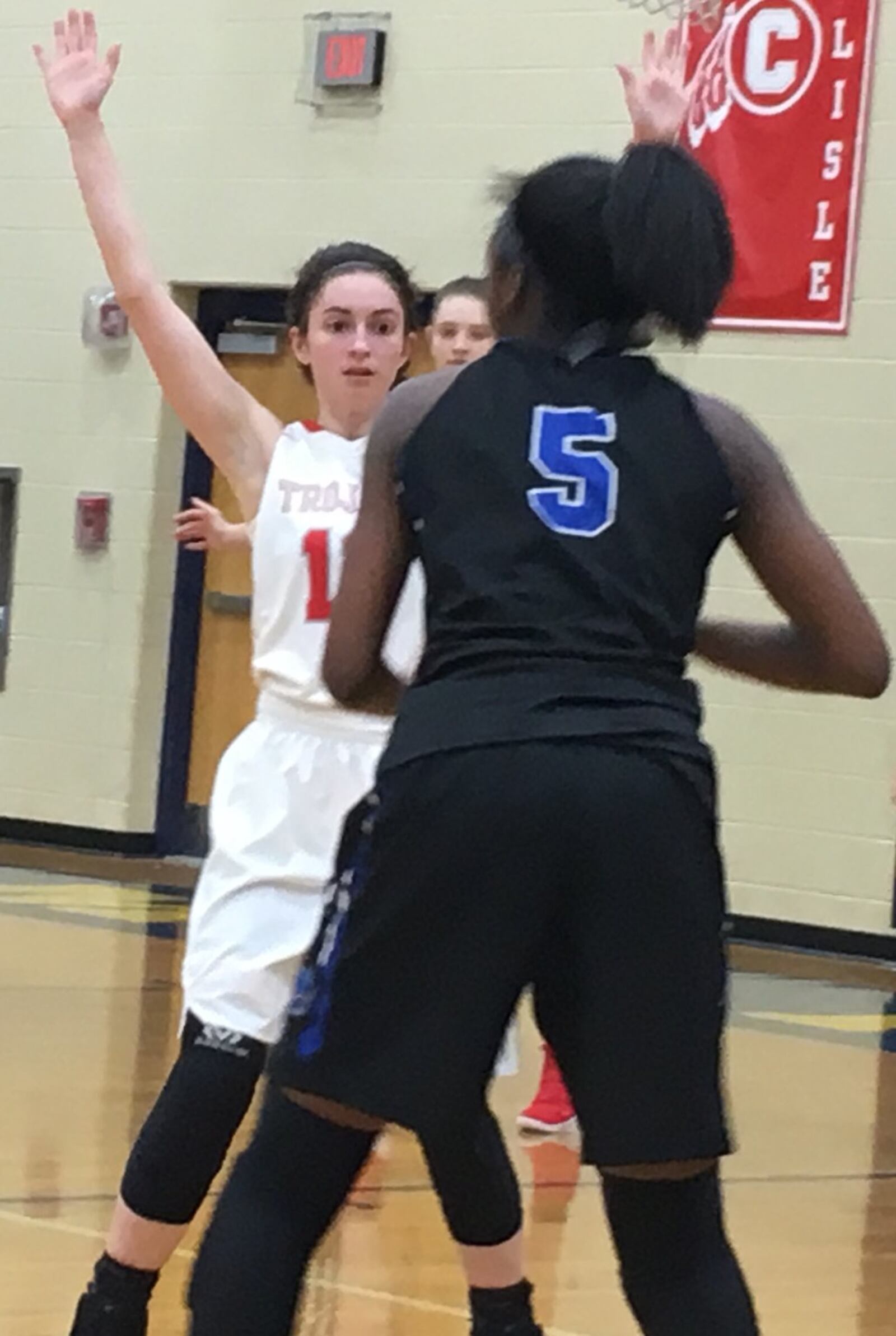 South Charleston Southeastern’s Payton Thompson (12) keeps a close eye on Cincinnati Christian’s Aaliyah Johnson (5) during Thursday night’s Division IV sectional game at Monroe. RICK CASSANO/STAFF