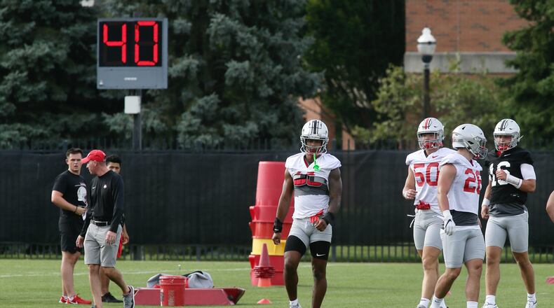 Alter grad C.J. Hicks, center, works at the first Ohio State practice of the season on Thursday, Aug. 4, 2022, at the Woody Hayes Athletic Center in Columbus. David Jablonski/Staff