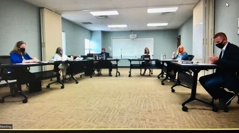 A former Lakota school parent has filed a lawsuit accusing the district's governing board of not fulfilling all the legal requirements of public meetings and deliberations mandated by Ohio law. The lawsuit claims the board's record of meeting minutes are inadequate and it falls short in alerting the public to board committee meetings. Pictured is the board during a September meeting. (File Photo\Journal-News)
