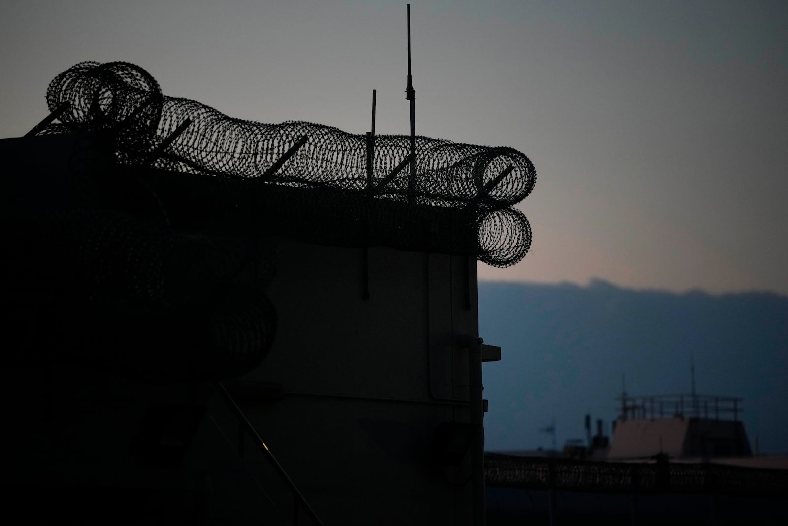 FILE -Exterior view of Shek Pik Prison is seen in Hong Kong, Jan. 19, 2022. (AP Photo/Kin Cheung, File)