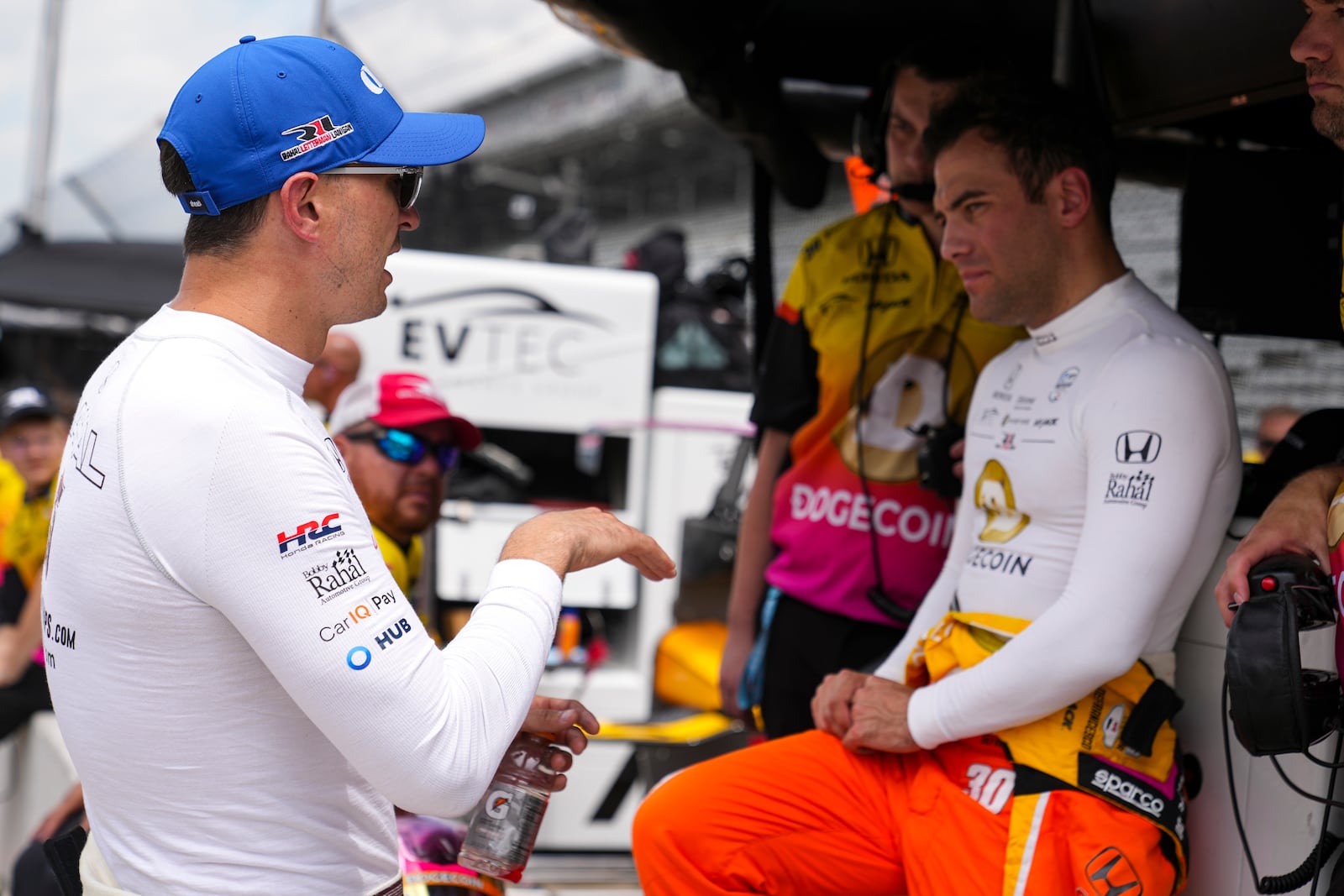 Drivers Graham Rahal, left, talks with Devlin DeFrancesco, of Canada, during practice for the Indianapolis 500 auto race at Indianapolis Motor Speedway in Indianapolis, Thursday, May 15, 2025. (AP Photo/Michael Conroy)