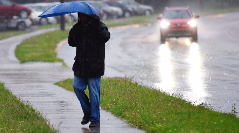 A pedestrian walks along Amanda Road in Middletown on Friday. NICK GRAHAM/STAFF