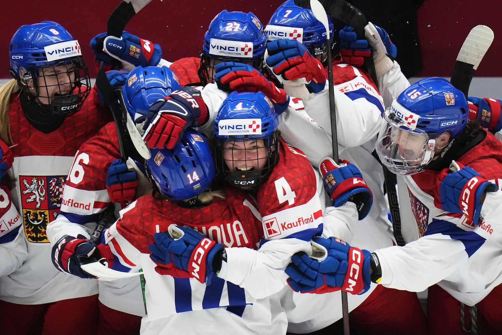 Dominika Laskova of Czech Republic celebrates with teammates after scoring her sides third goal during the bronze medal match between Czech Republic and Finland at the Women's Ice Hockey Championships in Ceske Budejovice, Czech Republic, Sunday, April 20, 2025. (AP Photo/Petr David Josek)