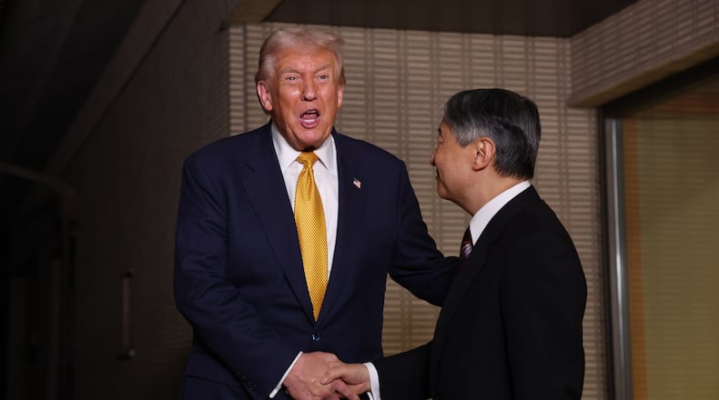 President Donald Trump, left, and Japan's Emperor Naruhito shake hands during their meeting at the Imperial Palace in Tokyo, Oct. 27, 2025. (Issei Kato/Pool Photo via AP)