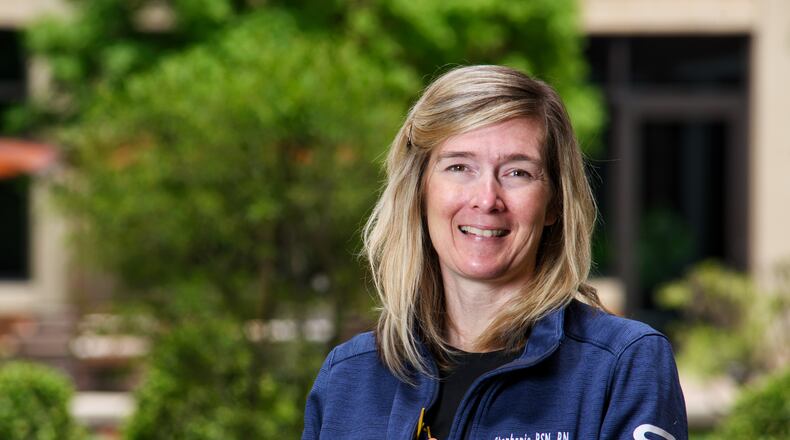 When the coronavirus pandemic hit, Stephanie Little pivoted from being a cardiac surgical nurse to being a pulmonary critical care nurse at Atrium Medical Center. When elective surgeries were halted by the state, she became a leader in Atrium’s High Risk Respiratory Unit, or “the COVID Unit.” Then in late 2020, the 46-year-old was diagnosed with cancer and went through major surgery and chemotherapy in the middle of the global pandemic. NICK GRAHAM / STAFF