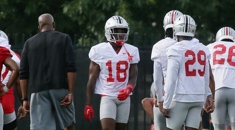 Cornerback Jyaire Brown (18), of Lakota West, warms up at the the first Ohio State practice of the season on Thursday, Aug. 4, 2022, at the Woody Hayes Athletic Center in Columbus. David Jablonski/Staff
