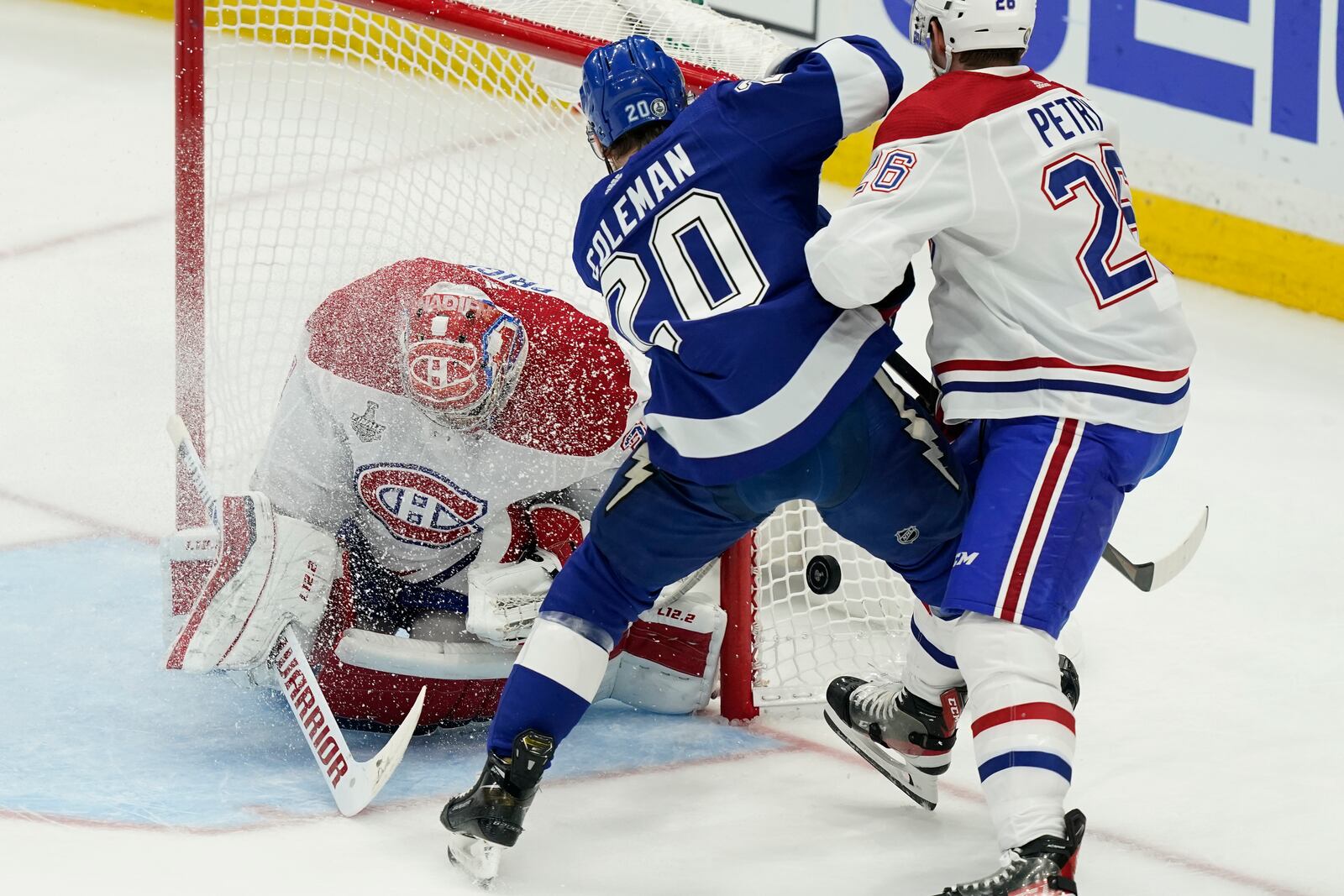 Montreal Canadiens defenseman Jeff Petry (26) checks Tampa Bay Lightning center Blake Coleman (20) next to Canadiens goaltender Carey Price (31) during the first period in Game 5 of the NHL hockey Stanley Cup finals, Wednesday, July 7, 2021, in Tampa, Fla. (AP Photo/Gerry Broome)