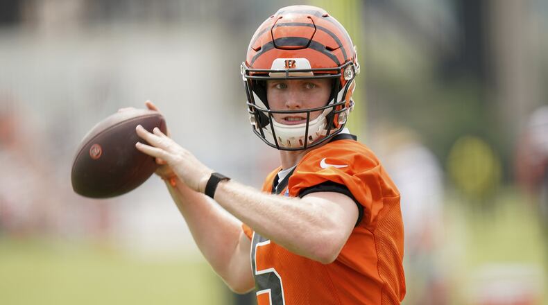 Cincinnati Bengals quarterback Ryan Finley (5) throws the ball during NFL football training camp, Monday, July 29, 2019, in Cincinnati. (AP Photo/Bryan Woolston)