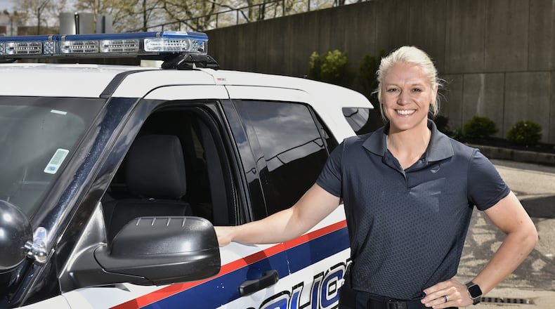 Jamie Patterson, 28, a 2010 Middletown High School graduate, has been hired as Middletown's newest police officer. She was sworn in two weeks ago and is training with Keith Maxwell, a 23-year veteran on the force. NICK GRAHAM/STAFF