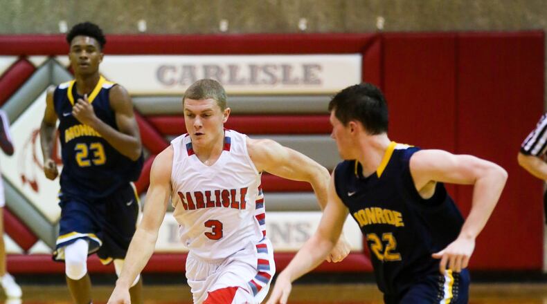 Carlisle guard Jake Moore (3) drives up the court during a game against visiting Monroe on Dec. 6, 2016. GREG LYNCH/STAFF