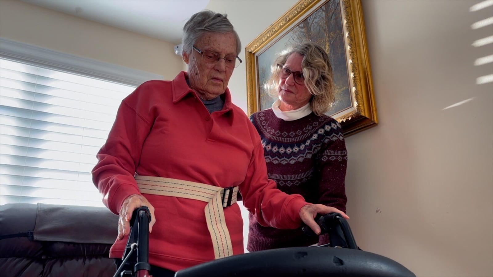 Annette Sargent helps her mom walk around their Mason home. Helen Goodrich is 95, and she has dementia. KEITH BIERYGOLICK/WCPO