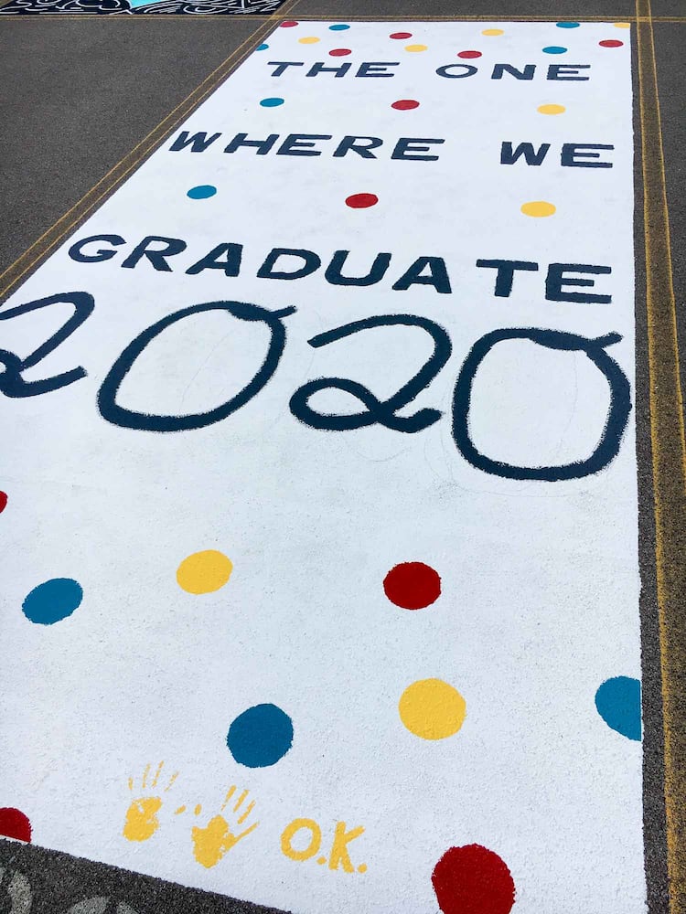 PHOTOS Lakota East seniors paint parking spots