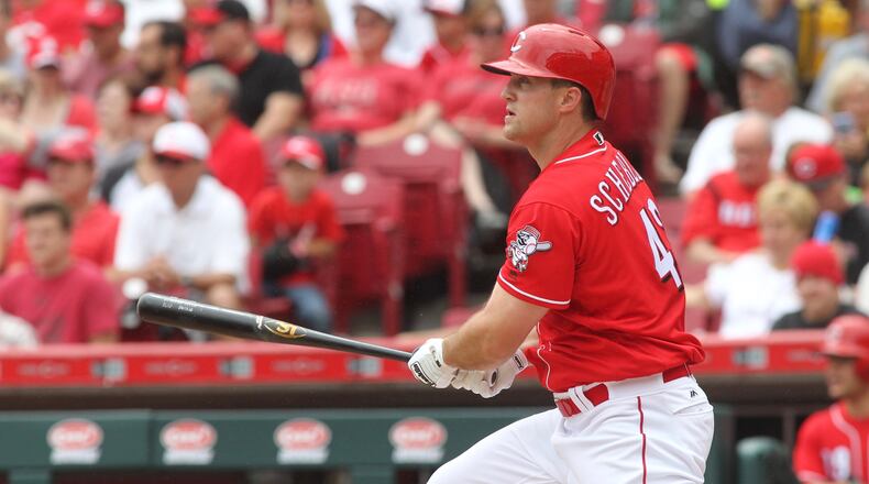 The Reds’ Scott Schebler swings against the Rockies on Sunday, May 21, 2017, at Great American Ball Park in Cincinnati. David Jablonski/Staff