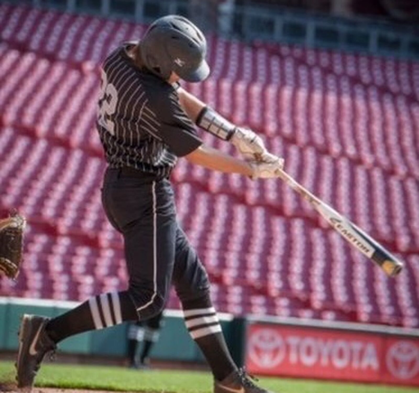 Lakota East catcher Dan Sewak takes a cut during a game at Great American Ball Park in Cincinnati this season. PHOTO COURTESY OF LAKOTA EAST ATHLETICS