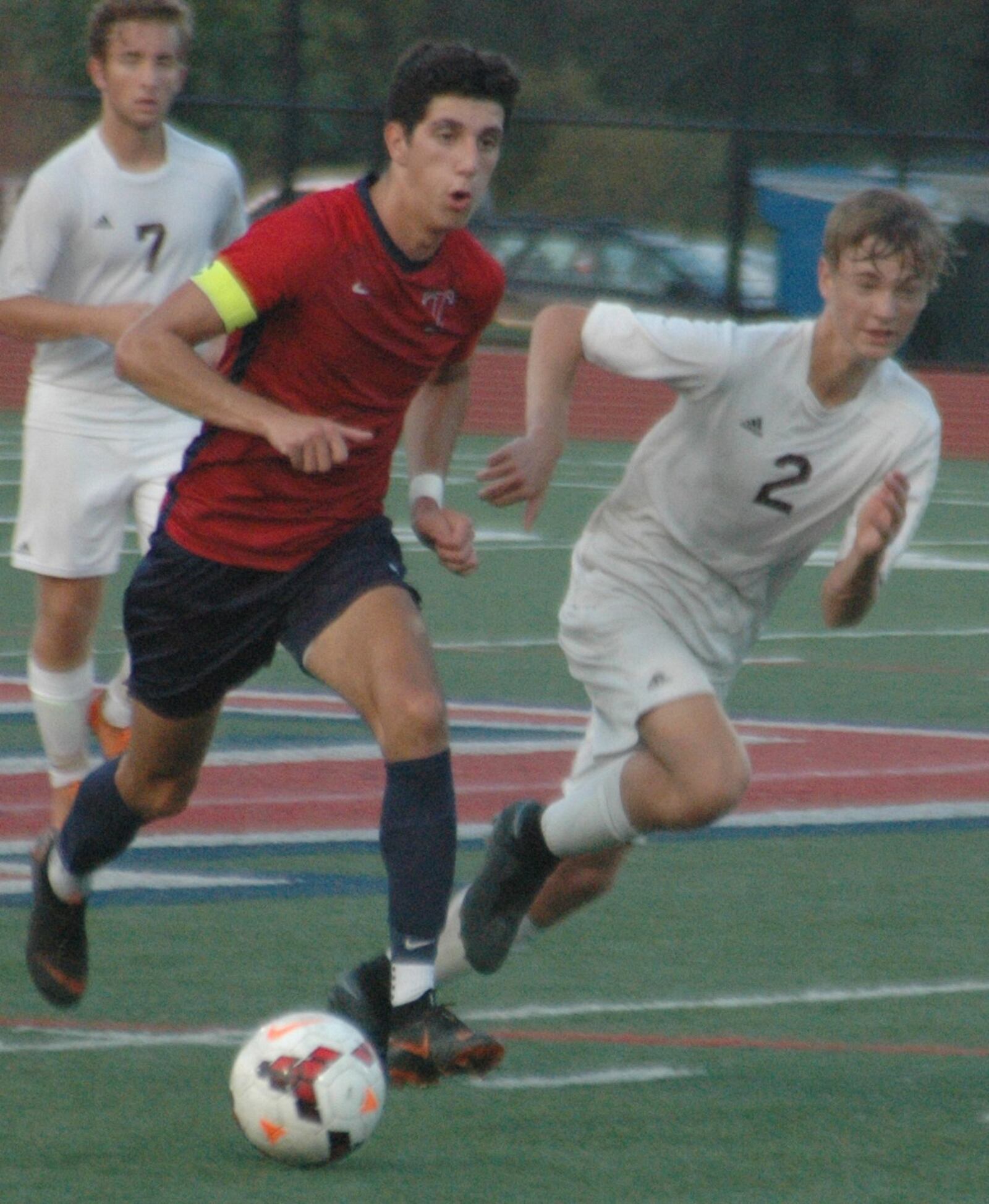 Talawanda’s Sam Robinson (7) dribbles past Logan Spaw (2) of Ross on Tuesday night in Oxford. Robinson had one goal as the Braves won 3-0. RICK CASSANO/STAFF