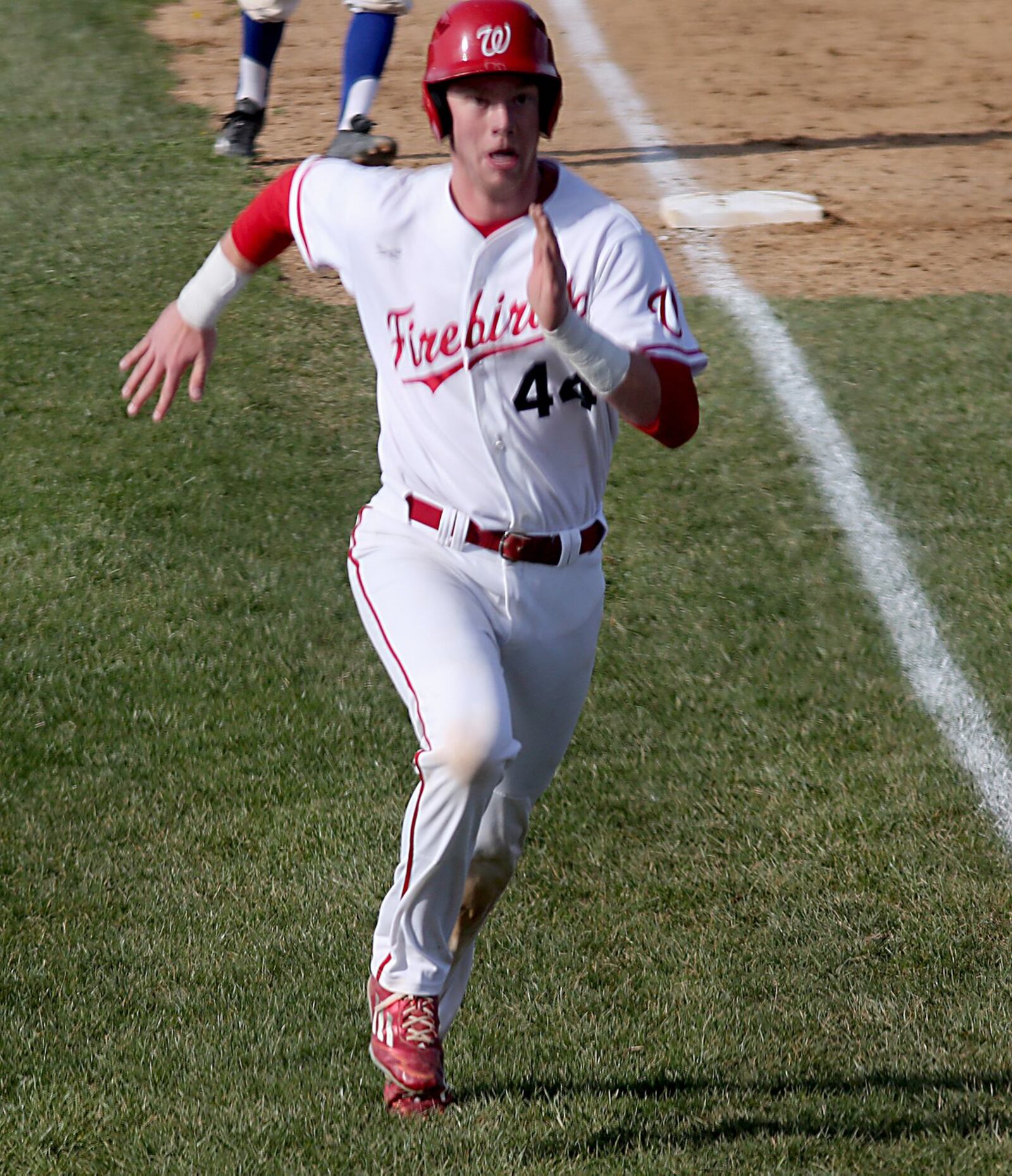 Dominic Schivone heads home to score Lakota West’s third run in the first inning Sunday during a game against visiting Hamilton. CONTRIBUTED PHOTO BY E.L. HUBBARD