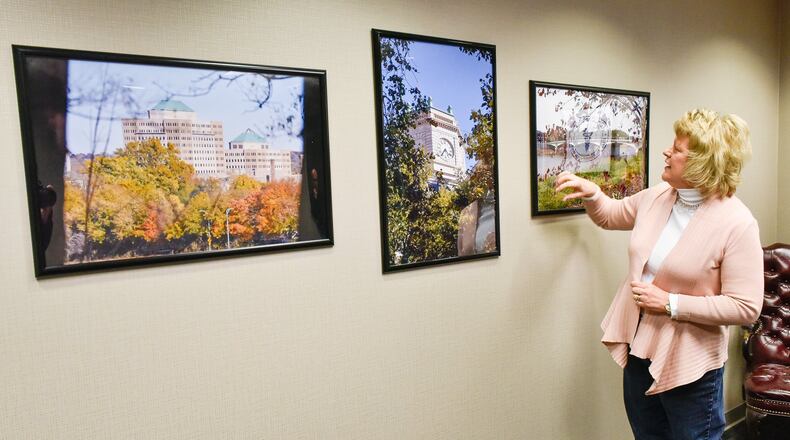 The Butler County Coroner’s Office on the sixth floor of the Butler County Government Services Center in Hamilton has gotten a face lift after many years and brightening up the walls are photographs of the city taken by longtime medical secretary Sally Poynter. Poynter has worked for the coroner’s office for thirty-four years and was thrilled to have her photos displayed on the walls of the office. NICK GRAHAM/STAFF