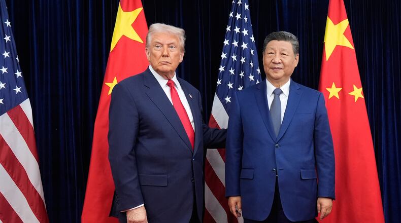 FILE - President Donald Trump, left, and Chinese President Xi Jinping pose ahead of their summit talk at Gimhae International Airport in Busan, South Korea, Oct. 30, 2025. (AP Photo/Mark Schiefelbein, File