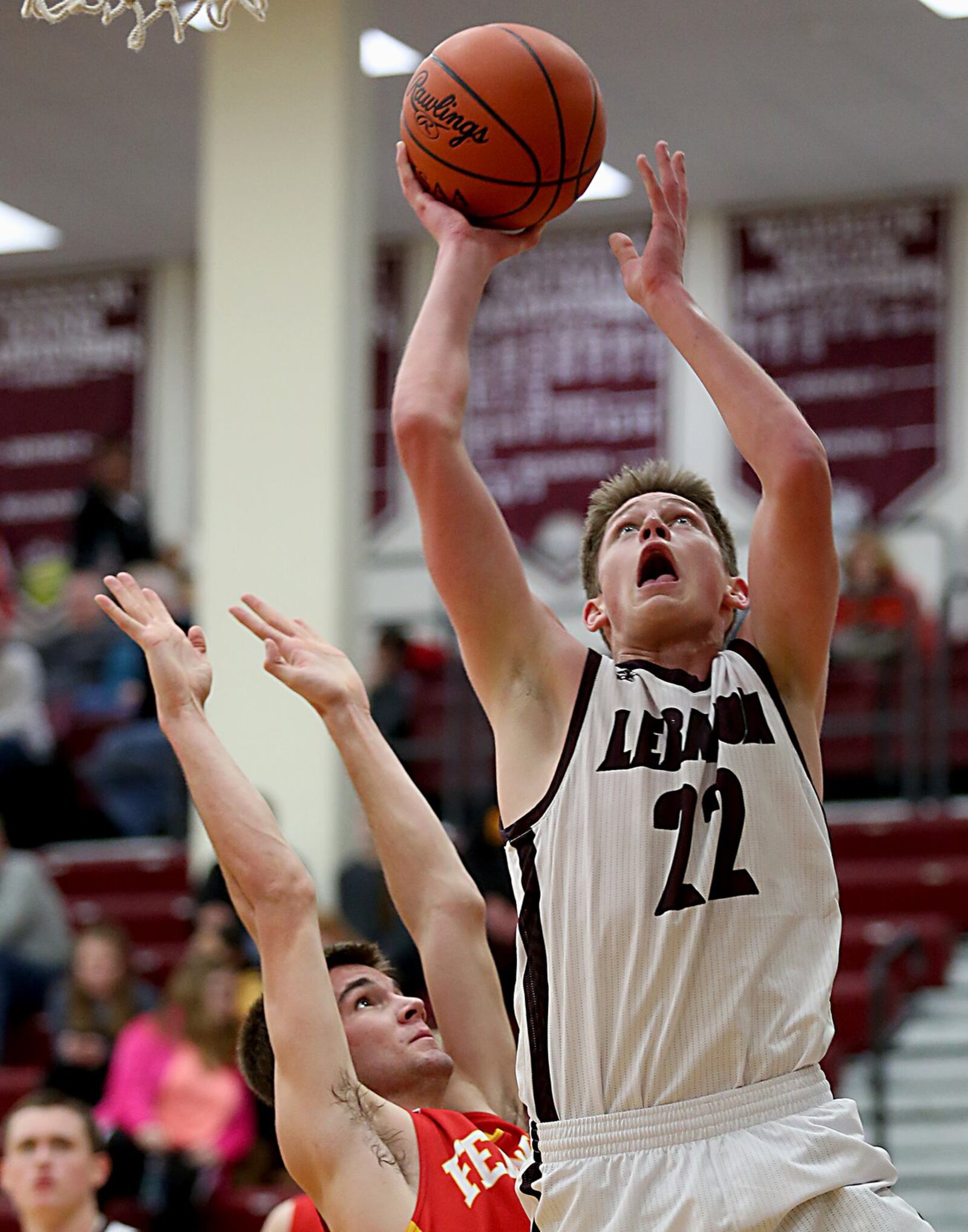 Lebanon guard Parker Smith goes up for a shot as Fenwick guard Paul Blodgett defends during their game at Lebanon on Saturday night. CONTRIBUTED PHOTO BY E.L. HUBBARD