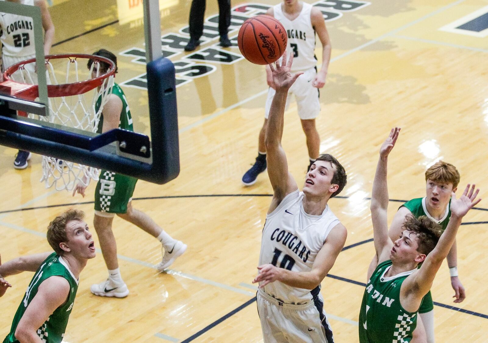 Edgewood’s Gabe Allen puts up a shot between (from left) Badin’s Justin Pappas, Joseph Walsh and Zach Switzer on Friday night at Ron Kash Court in St. Clair Township. Badin won 49-46. NICK GRAHAM/STAFF