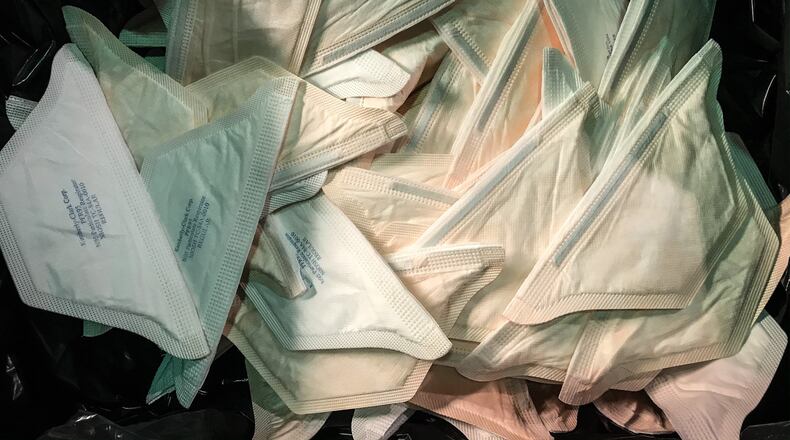 Face masks being prepared for use by Miamisburg company epluno. JIM NOELKER/STAFF