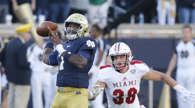 Notre Dame quarterback Brandon Wimbush drops back to pass with pressure from Miami linebacker Brad Koenig during a nonconference game Sept. 30, 2017, in South Bend, Ind. CHARLES REX ARBOGAST/ASSOCIATED PRESS