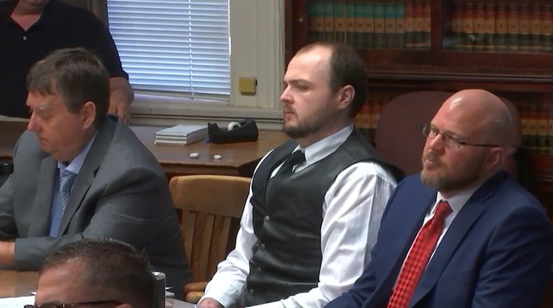 George Wagner IV, middle, is seen in court in Pike County on Monday, Sept. 12, 2022. Wagner faces multiple counts in the 2016 murders of eight members of the Rhoden family. LIVE FEED PHOTO/WCPO