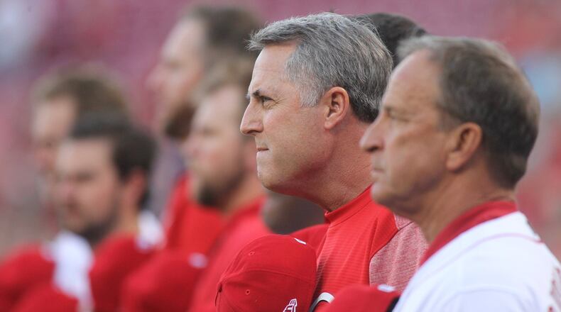 Reds manager Bryan Price stands for the national anthem before a game against the Brewers on Thursday, April 13, 2017, at Great American Ball Park in Cincinnati. David Jablonski/Staff