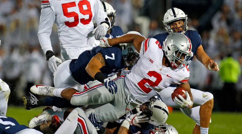 STATE COLLEGE, PA - SEPTEMBER 29: J.K. Dobbins #2 of the Ohio State Buckeyes is tackled by Koa Farmer #7 of the Penn State Nittany Lions on September 29, 2018 at Beaver Stadium in State College, Pennsylvania. (Photo by Justin K. Aller/Getty Images)