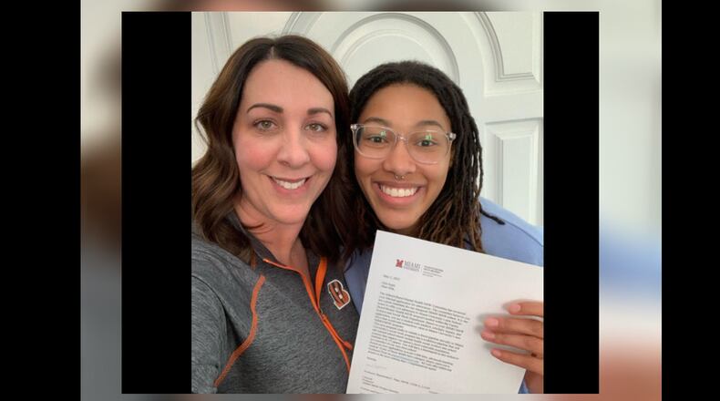 Miami social work major Alia Agee poses with an acceptance letter to the internship program with her stepmother Cindy. CONTRIBUTED/OXFORD OBSERVER