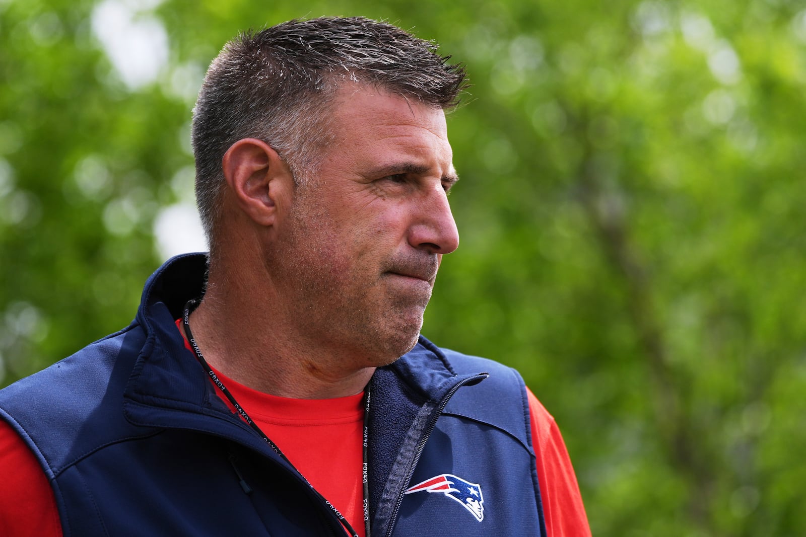 New England Patriots head coach Mike Vrabel walks towards the field during an NFL football practice, Wednesday, May 28, 2025, in Foxborough, Mass. (AP Photo/Charles Krupa)