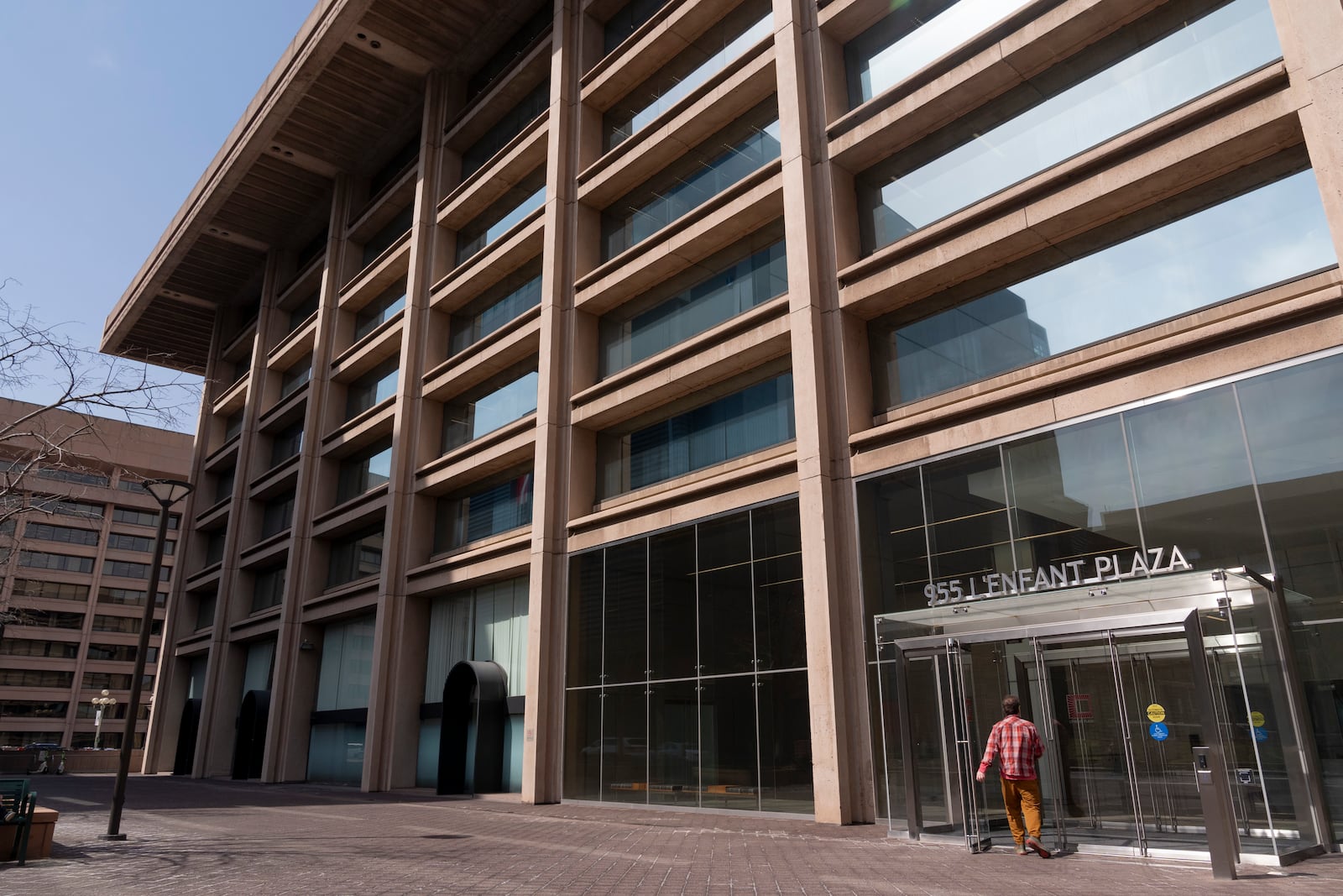 FILE - A man enters the building that houses the offices of the Institute of Museum and Library Services (IMLS), Thursday, March 20, 2025, in Washington. (AP Photo/Jacquelyn Martin)