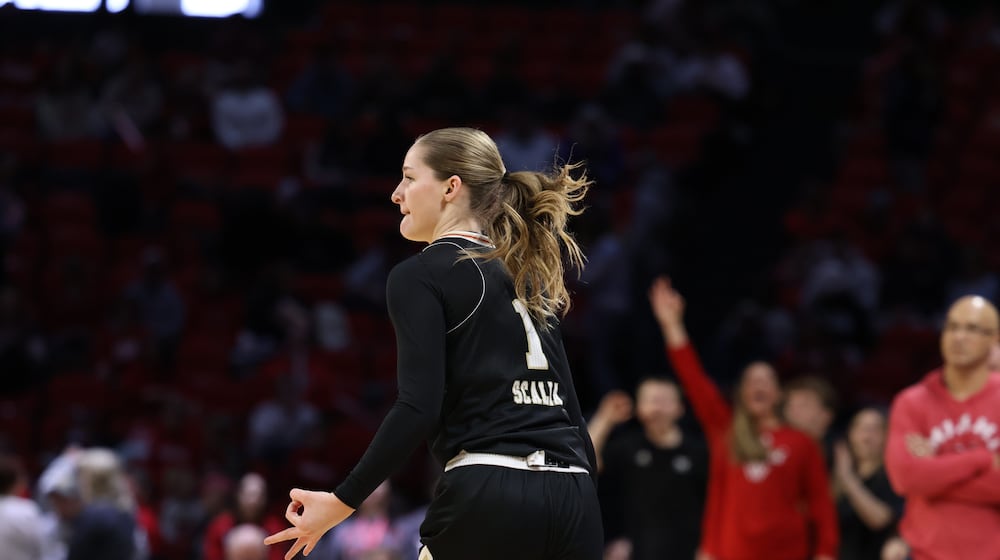 Miami’s Amber Scalia celebrates after hitting a 3-pointer against Ohio on Saturday, Jan. 31, 2026 at Millett Hall. CHRIS VOGT / CONTRIBUTED