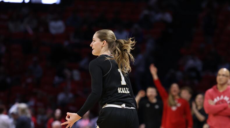Miami’s Amber Scalia celebrates after hitting a 3-pointer against Ohio on Saturday, Jan. 31, 2026 at Millett Hall. CHRIS VOGT / CONTRIBUTED