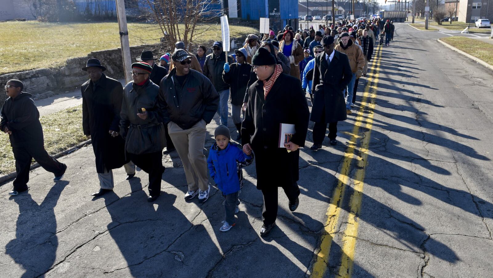 A group of walkers fill the street on their way down Front Street for the Martin Luther King, Jr. Day march Monday, Jan. 19 in Hamilton. NICK GRAHAM/STAFF