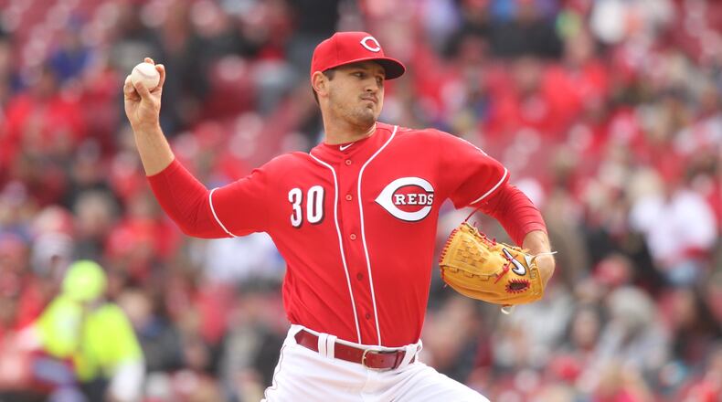 Reds starter Tyler Mahle pitches against the Cubs on Monday, April 2, 2018, at Great American Ball Park in Cincinnati. David Jablonski/Staff