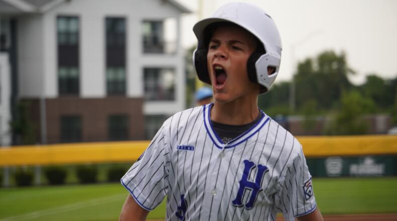West Side Little League's Lennox Brown celebrates after scoring a run during his Great Lakes Region winner's bracket semifinal game against Illinois on Monday at the Little League Central Region Complex in Whitestown, Indiana. West Side won 11-1 in four innings. CHRIS VOGT / CONTRIBUTED