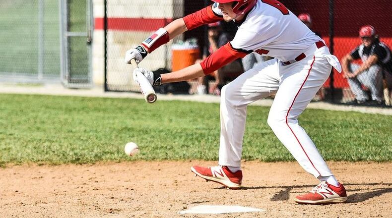 Madison’s Jake Edwards puts down a sacrifice bunt during an April 26 game against Carlisle in Madison Township. The host Mohawks won 3-1. NICK GRAHAM/STAFF