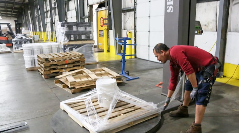 Franklin Cortez wrapped an item for shipment at LeSaint Logistics in Fairfield, Wednesday, Sept. 13, 2017. GREG LYNCH / STAFF