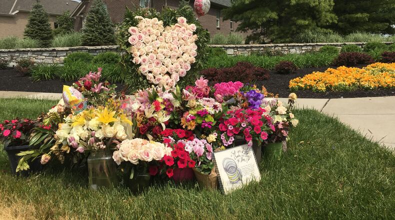 A floral memorial was placed across from where a traffic accident this month resulted in the death of a Butler County woman assisting crash victims and heightened residents’ concern about traffic safety in the fast-growing area along the Butler-Warren county line, east of Interstate 75. STAFF / LAWRENCE BUDD