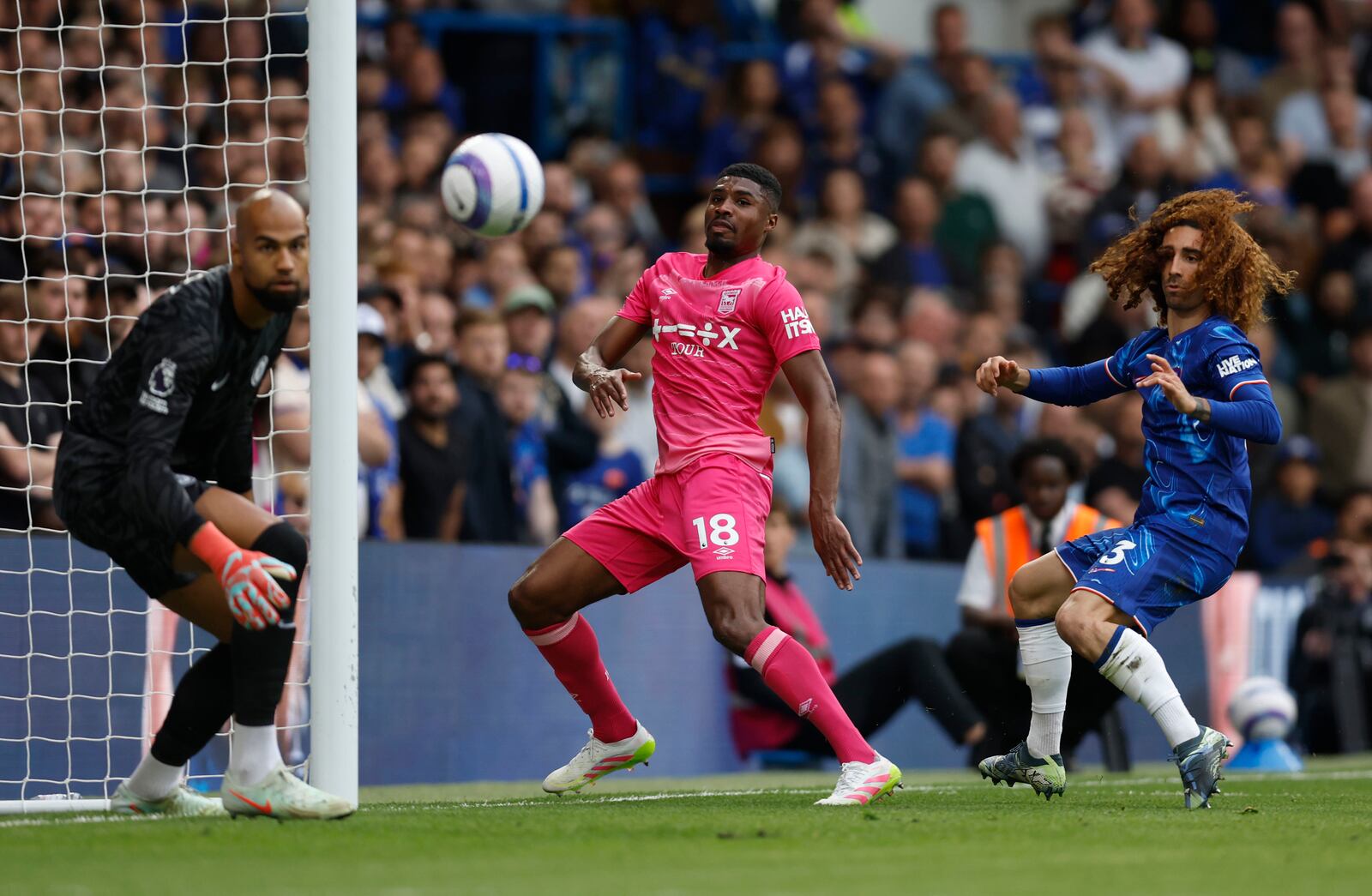 Ipswich Town's Ben Johnson, center, scores their side's second goal of the game during the English Premier League soccer match between Chelsea and Ipswich Town at Stamford Bridge in London, Sunday April 13, 2025. (Nigel French/PA via AP)