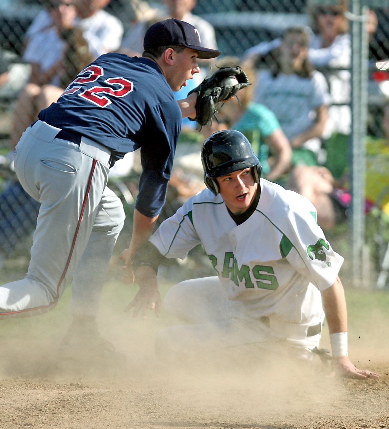 Talawanda pitcher Howie Smith (22) is late in tagging Badin runner Nate Snellgrove (25) after a passed ball at the plate during a game at Alumni Field in Hamilton on April 6, 2010. GREG LYNCH/STAFF