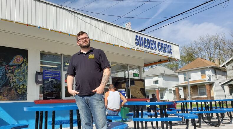Sweden Creme owner Teddy Young stands outside the business at 2047 Pleasant Ave. in Hamilton's Lindenwald neighborhood. ERIC SCHWARTZBERG/STAFF