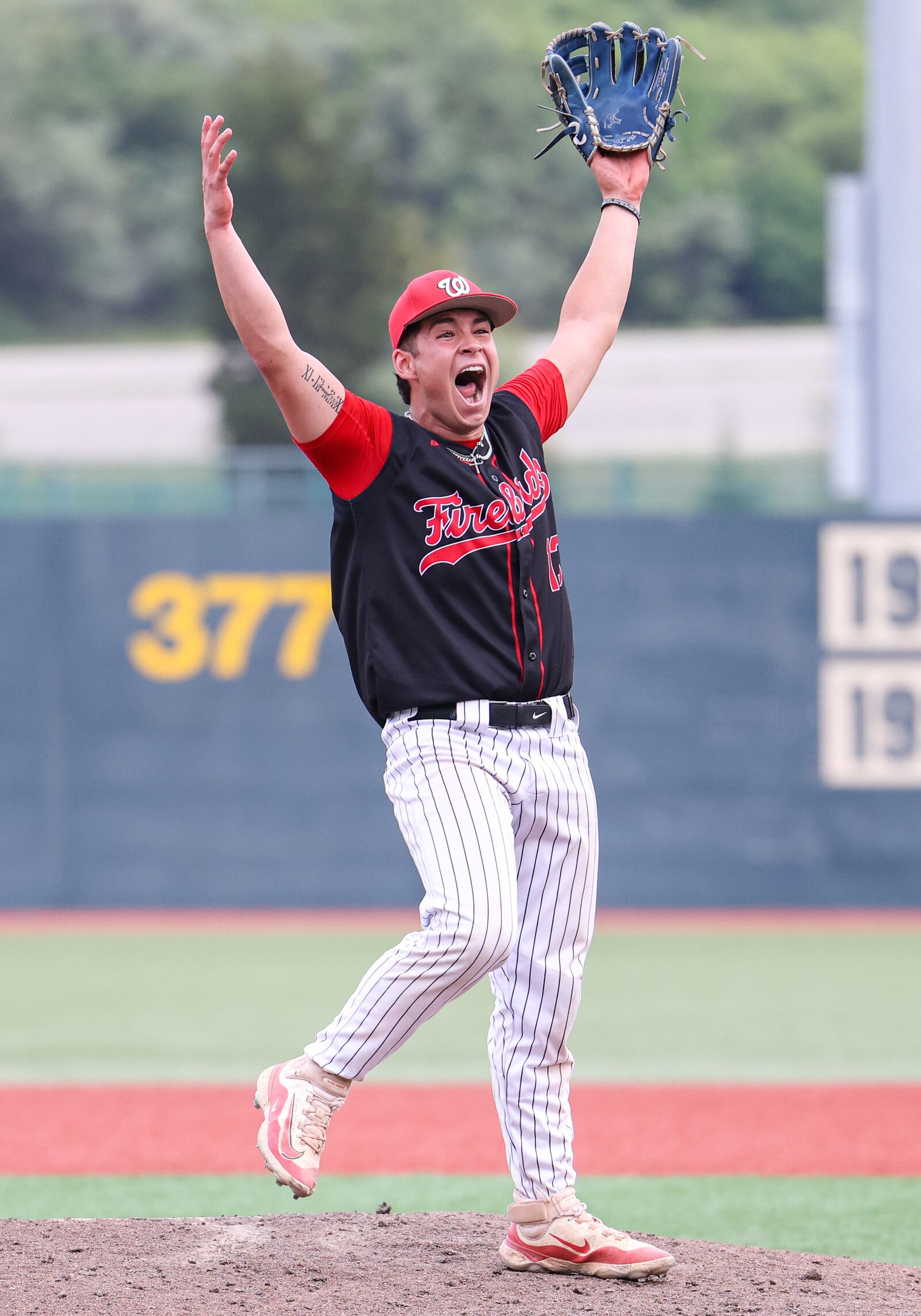 Lakota West senior pitcher Adrian Smith celebrates after a 3-2 win over Cincinnati Moeller in a Division I regional final on Wednesday at Wright State University's Nischwitz Stadium. Smith threw a complete game and gave up two hits while striking out nine batters. BRYANT BILLING / STAFF